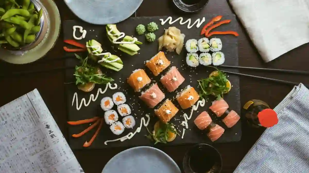 Assorted sushi on a black ceramic plate