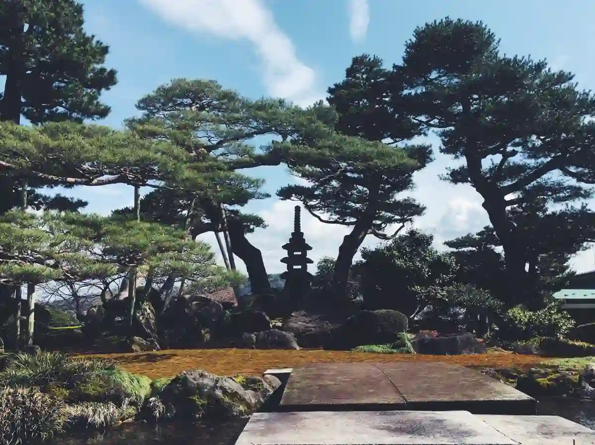 A landscaped garden with rocks and a walking path in Kanazawa