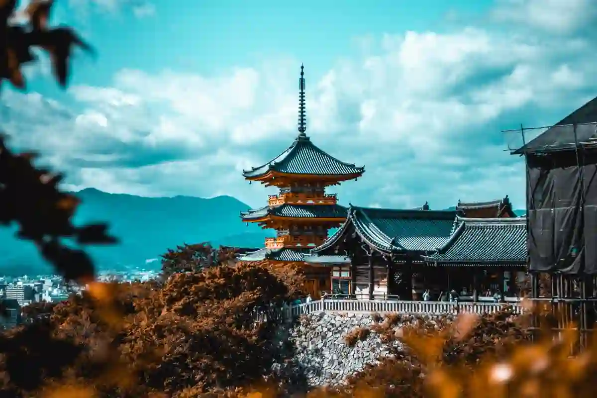 Visitors near the wooden pagoda at Kiyomizu-dera temple in Kyoto