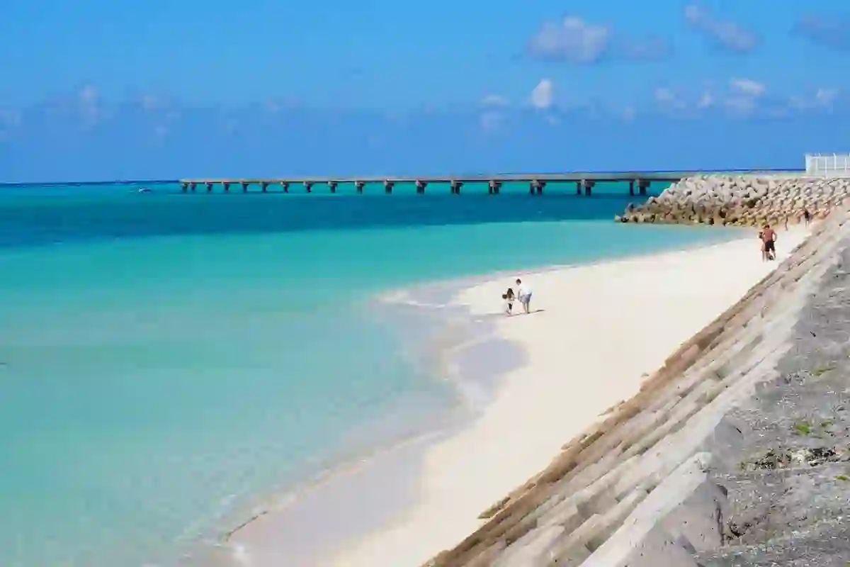 A person walking along a beach in Okinawa